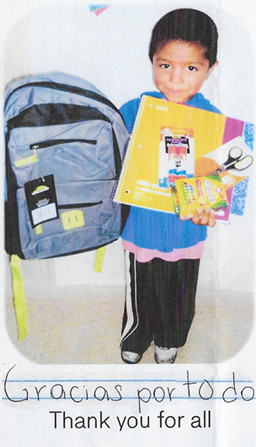Little boy with school supplies