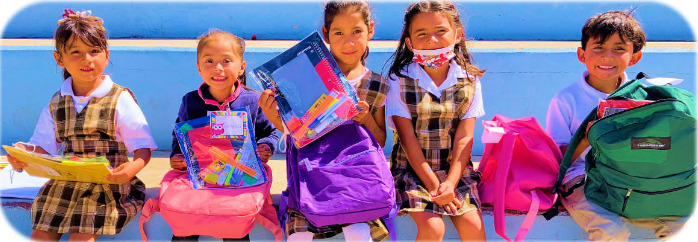 Group of children with school supplies